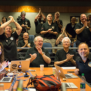 Part of the New Horizons team celebrating the spacecraft's flyby of Pluto.